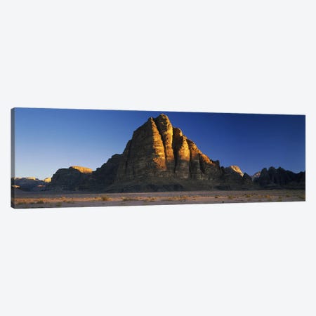 Rock formations on a landscapeSeven Pillars of Wisdom, Wadi Rum, Jordan Canvas Print #PIM10120} by Panoramic Images Canvas Print