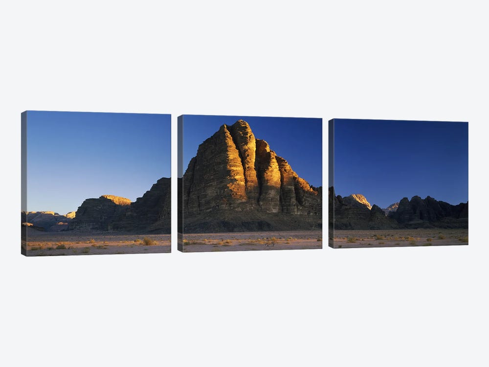 Rock formations on a landscapeSeven Pillars of Wisdom, Wadi Rum, Jordan by Panoramic Images 3-piece Canvas Art Print