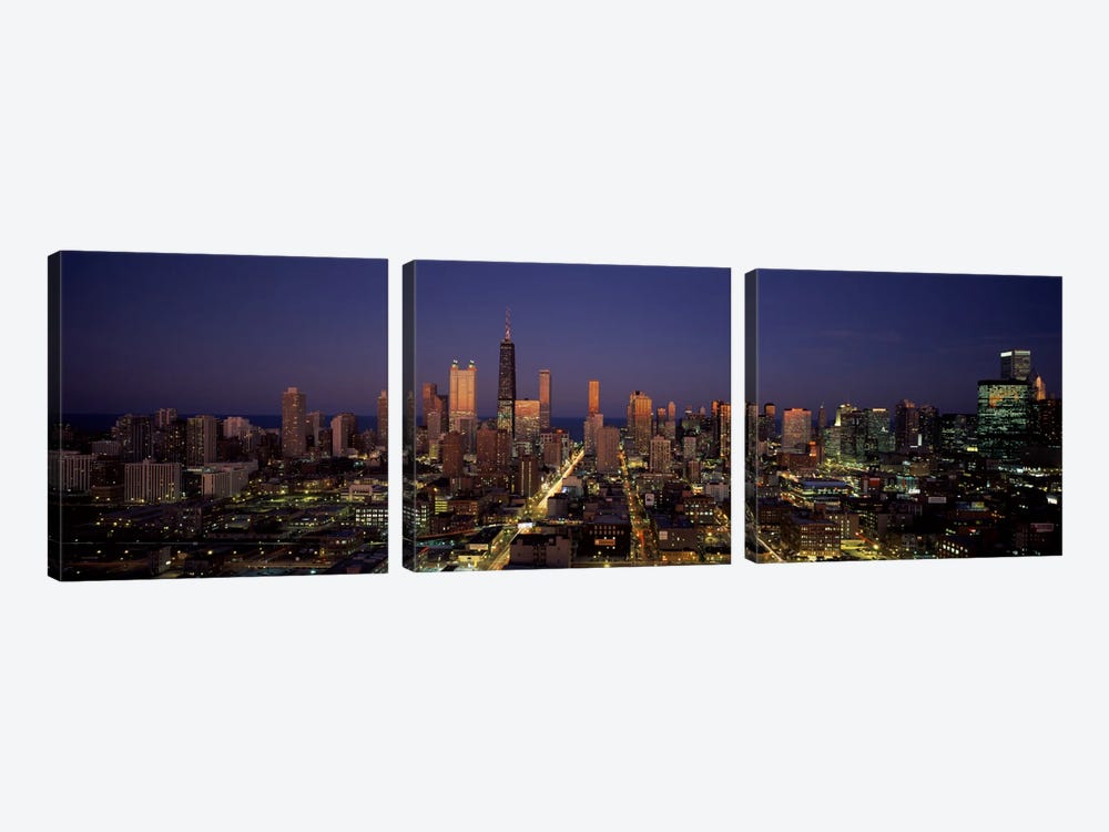 Skyscrapers in a city lit up at dusk, Chicago, Illinois, USA by Panoramic Images 3-piece Canvas Art