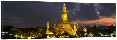 Buddhist temple lit up at dawn, Wat Arun, Chao Phraya River, Bangkok, Thailand Canvas Art Print - Buddhism Art