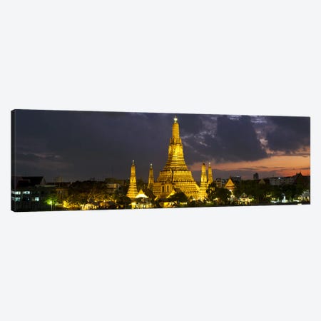 Buddhist temple lit up at dawn, Wat Arun, Chao Phraya River, Bangkok, Thailand Canvas Print #PIM10336} by Panoramic Images Canvas Art Print