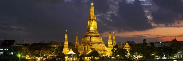 Buddhism: Buddhist temple lit up at dawn, Wat Arun, Chao Phraya River, Bangkok, Thailand by Panoramic Images