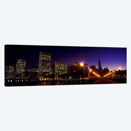 Buildings at the waterfront lit up at dusk, San Francisco, California, USA Canvas Print #PIM10425} by Panoramic Images Art Print