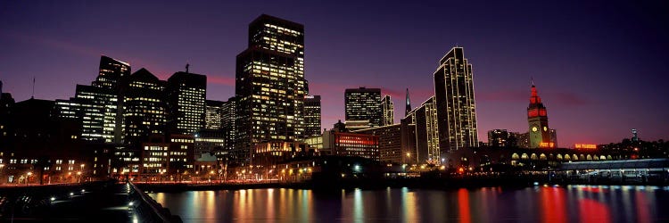 Buildings at the waterfront lit up at dusk, San Francisco, California, USA