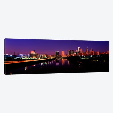 Buildings lit up at the waterfront, Philadelphia, Schuylkill River, Pennsylvania, USA Canvas Print #PIM10571} by Panoramic Images Canvas Artwork