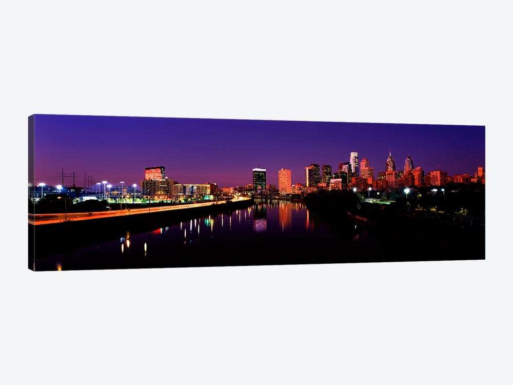 Buildings lit up at the waterfront, Philadelphia, Schuylkill River, Pennsylvania, USA by Panoramic Images 1-piece Canvas Artwork