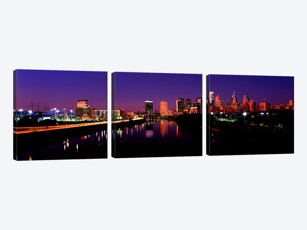 Buildings lit up at the waterfront, Philadelphia, Schuylkill River, Pennsylvania, USA by Panoramic Images 3-piece Canvas Art