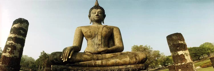 Low angle view of a statue of Buddha, Sukhothai Historical Park, Sukhothai, Thailand