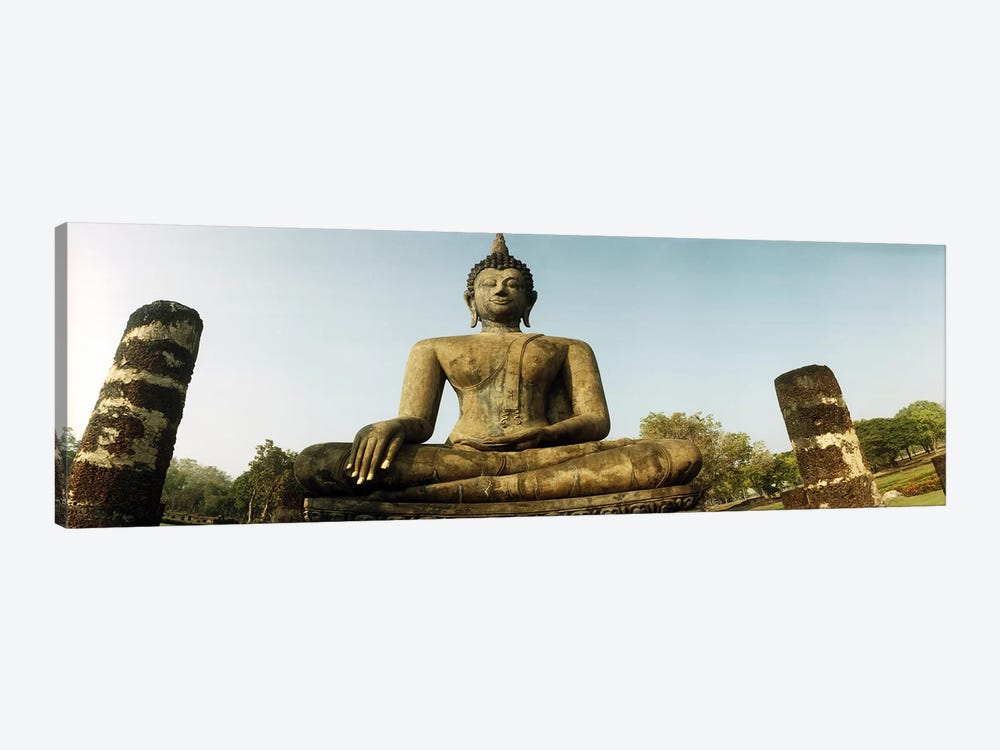 Low angle view of a statue of Buddha, Sukhothai Historical Park, Sukhothai, Thailand by Panoramic Images 1-piece Canvas Print