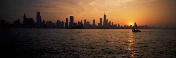 Lake Sunrises & Sunsets: Silhouette of buildings at the waterfront, Navy Pier, Chicago, Illinois, USA by Panoramic Images