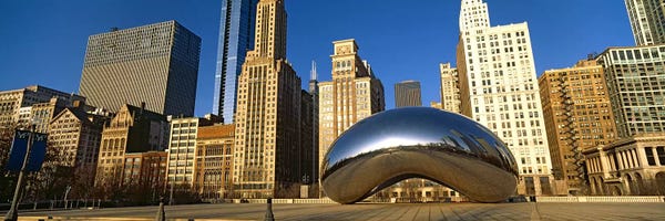 Cloud Gate (The Bean): Cloud Gate sculpture with buildings in the background, Millennium Park, Chicago, Cook County, Illinois, USA by Panoramic Images