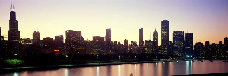 City skyline with Lake Michigan and Lake Shore Drive in foreground at dusk, Chicago, Illinois, USA