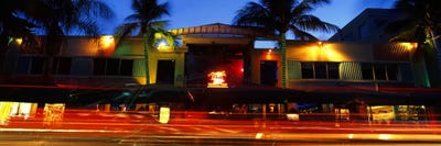 Traffic in front of a building at duskArt Deco District, South Beach, Miami Beach, Miami-Dade County, Florida, USA by Panoramic Images canvas print
