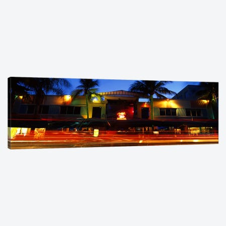 Traffic in front of a building at duskArt Deco District, South Beach, Miami Beach, Miami-Dade County, Florida, USA Canvas Print #PIM10699} by Panoramic Images Canvas Art Print