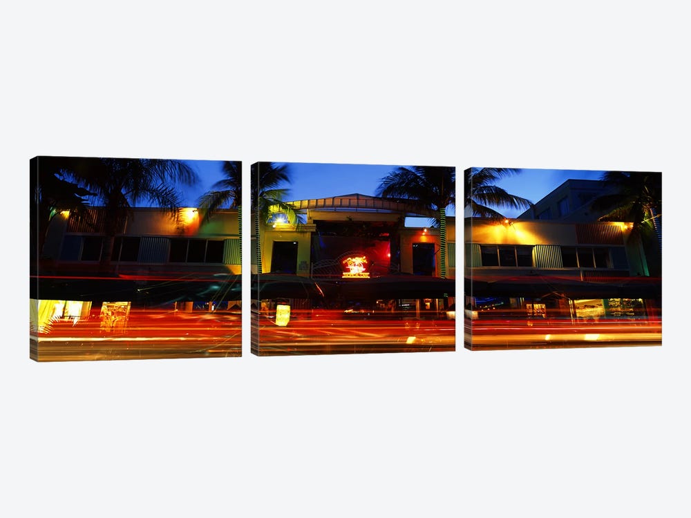 Traffic in front of a building at duskArt Deco District, South Beach, Miami Beach, Miami-Dade County, Florida, USA by Panoramic Images 3-piece Canvas Art
