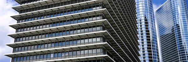 Texas: Low angle view of buildings in a city, ExxonMobil Building, Chevron Building, Houston, Texas, USA by Panoramic Images
