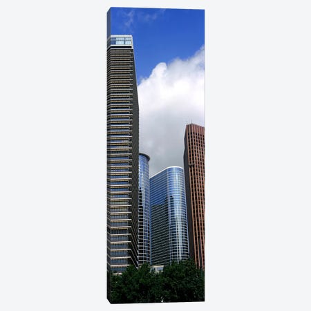 Low angle view of buildings in a city, Wedge Tower, ExxonMobil Building, Chevron Building, Houston, Texas, USA Canvas Print #PIM10758} by Panoramic Images Canvas Artwork