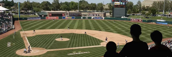 Stadiums: Spectator watching a baseball match at stadium, Raley Field, West Sacramento, Yolo County, California, USA by Panoramic Images