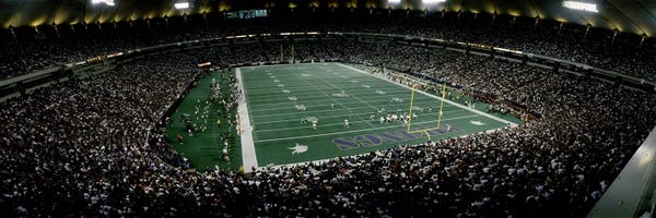 Minnesota: Spectators in an American football stadiumHubert H. Humphrey Metrodome, Minneapolis, Minnesota, USA by Panoramic Images