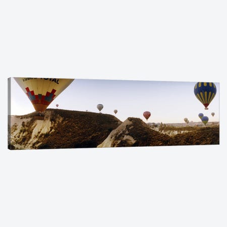 Hot air balloons over landscape at sunrise, Cappadocia, Central Anatolia Region, Turkey #2 Canvas Print #PIM10896} by Panoramic Images Canvas Wall Art