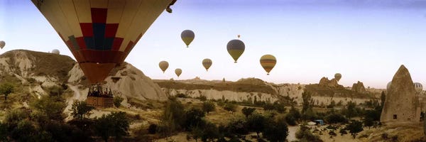 Extreme Sports: Hot air balloons over landscape at sunrise, Cappadocia, Central Anatolia Region, Turkey #3 by Panoramic Images