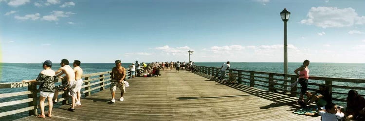 Tourists on the beach at Coney Island viewed from the pier, Brooklyn, New York City, New York State, USA