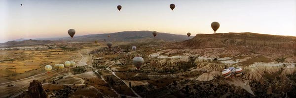 Adventure: Hot air balloons over landscape at sunrise, Cappadocia, Central Anatolia Region, Turkey #5 by Panoramic Images