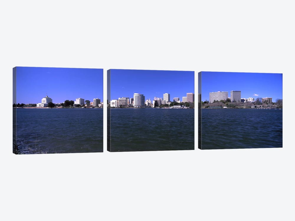Skyscrapers along a lake, Lake Merritt, Oakland, California, USA by Panoramic Images 3-piece Canvas Print
