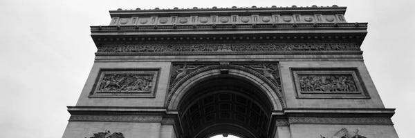 Arc de Triomphe: Low angle view of a triumphal arch, Arc de Triomphe, Paris, Ile-De-France, France by Panoramic Images