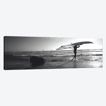 Man carrying a surfboard over his head on the beach, Santa Cruz, California, USA Canvas Print #PIM11130} by Panoramic Images Art Print