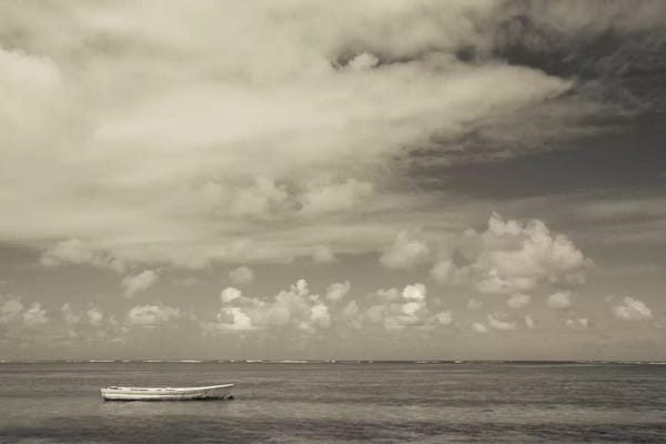 Puerto Rico: Seascape with a small boat, Playa Luquillo Beach, Luquillo, Puerto Rico by Panoramic Images