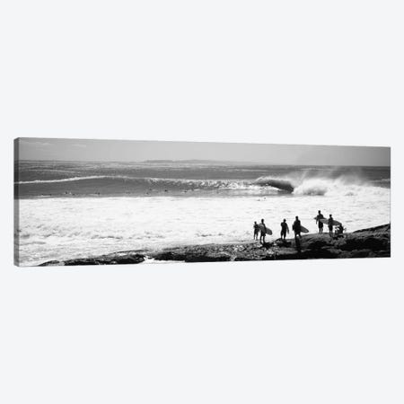 Silhouette of surfers standing on the beach, Australia Canvas Print #PIM11699} by Panoramic Images Canvas Artwork