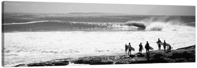 Silhouette of surfers standing on the beach, Australia Canvas Art Print - Surfing