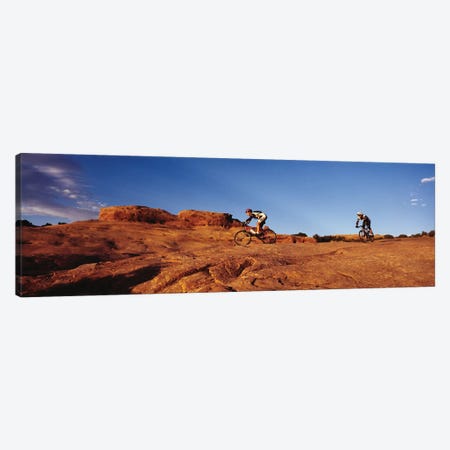 Two people mountain biking, Moab, Utah, USA Canvas Print #PIM11951} by Panoramic Images Art Print