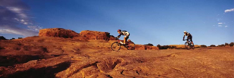 Two people mountain biking, Moab, Utah, USA