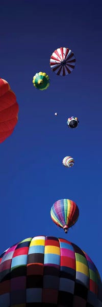 Low angle view of hot air balloons in the sky (vertical), Colorado, USA