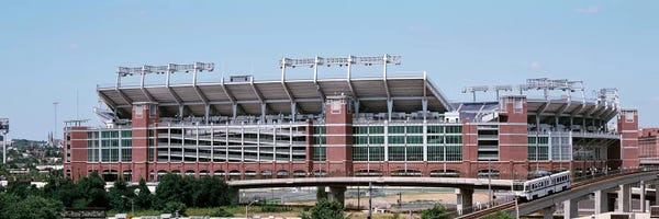 Maryland: Cable car passing by a stadium, M&T Bank Stadium, Baltimore, Maryland, USA by Panoramic Images