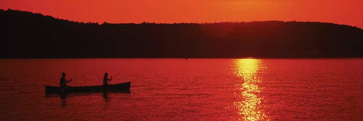 Tourists canoeing in a lake at sunset, Oquaga Lake, Deposit, Broome County, New York State, USA by Panoramic Images wall art