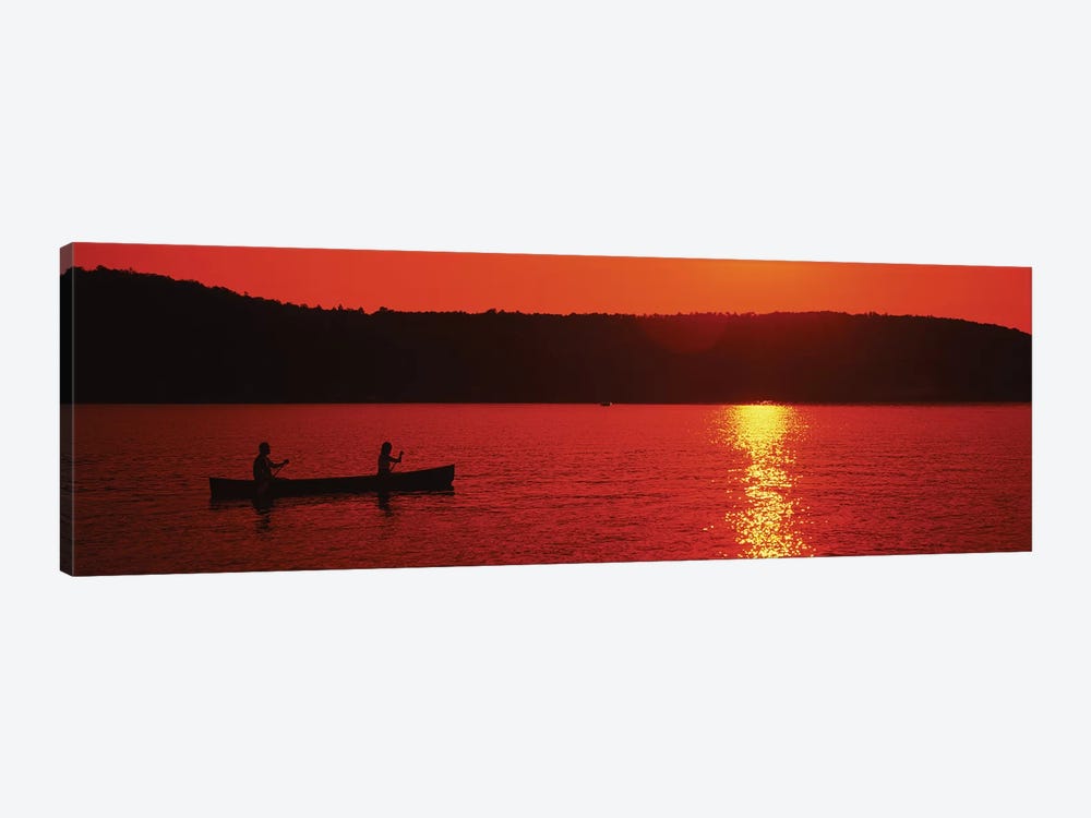 Tourists canoeing in a lake at sunset, Oquaga Lake, Deposit, Broome County, New York State, USA by Panoramic Images 1-piece Canvas Print