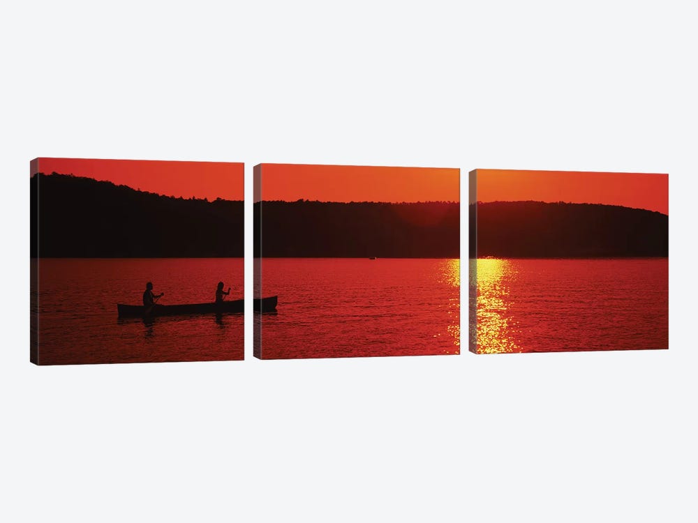 Tourists canoeing in a lake at sunset, Oquaga Lake, Deposit, Broome County, New York State, USA by Panoramic Images 3-piece Canvas Print