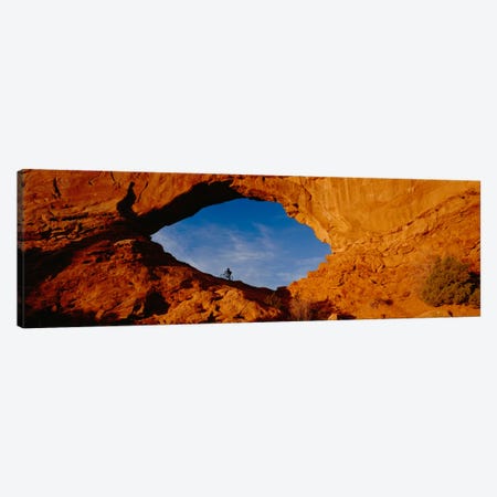 Lone Mountain Biker, North Window Arch, Arches National Park, Utah, USA Canvas Print #PIM12097} by Panoramic Images Art Print