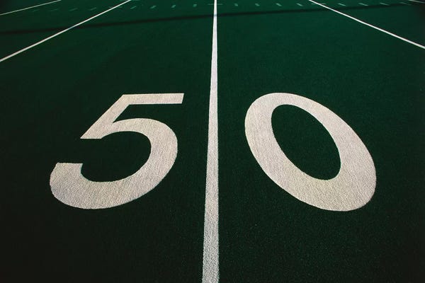 Football: 50 Yard Line of Football Field by Panoramic Images