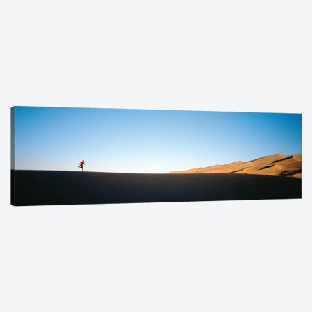 Low angle view of a woman running in the desert 2, Great Sand Dunes National Monument, Colorado, USA Canvas Print #PIM12287} by Panoramic Images Canvas Art