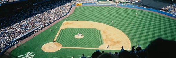 High angle view of spectators watching a baseball match in a stadium, Yankee Stadium, New York City, New York State, USA