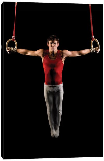 Young man exercising on gymnastic rings, Bainbridge Island, Washington State, USA Canvas Art Print - Fitness Fanatic