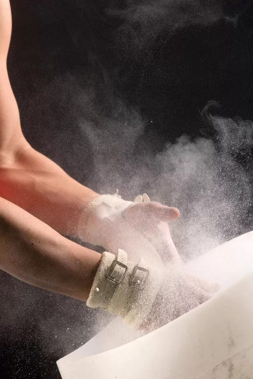 Male gymnast putting chalk on his hands, Bainbridge Island, Washington State, USA