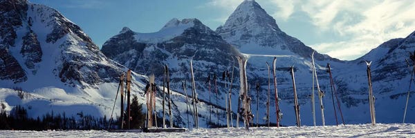 British Columbia: Skis and ski poles on a snow covered landscape, Mt Assiniboine, Mt Assiniboine Provincial Park, British Columbia, Canada by Panoramic Images