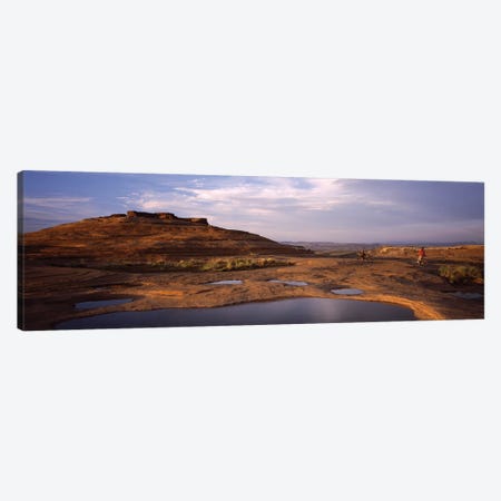 Mountain bike riders on a trail, Slickrock Trail, Sand Flats Recreation Area, Moab, Utah, USA Canvas Print #PIM12545} by Panoramic Images Art Print