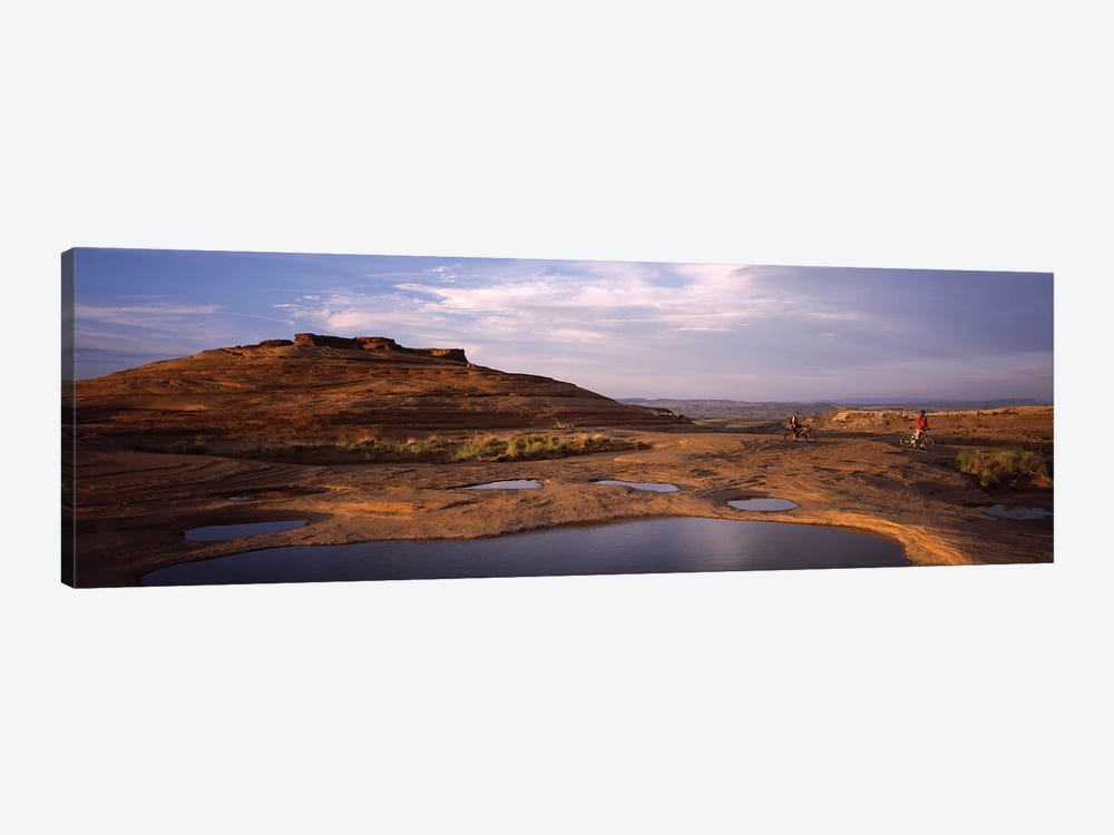 Mountain bike riders on a trail, Slickrock Trail, Sand Flats Recreation Area, Moab, Utah, USA by Panoramic Images 1-piece Art Print