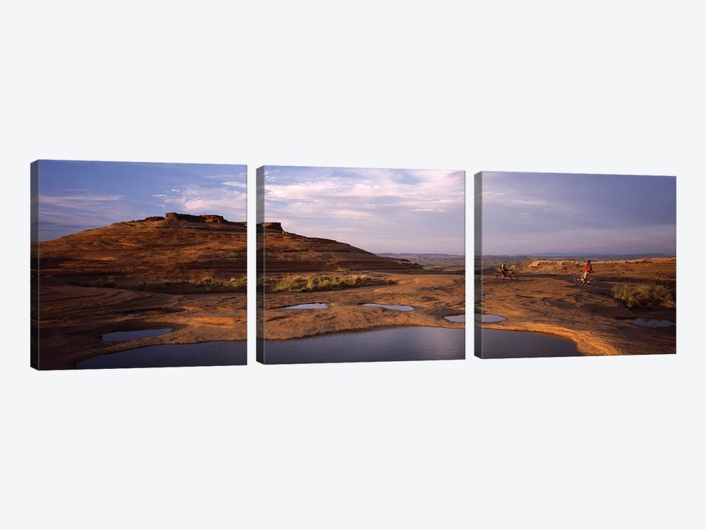 Mountain bike riders on a trail, Slickrock Trail, Sand Flats Recreation Area, Moab, Utah, USA by Panoramic Images 3-piece Canvas Print